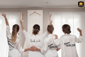 At the bride-to-be’s parents' home in Beauzelle, Haute-Garonne, the bride and bridesmaids stand by the window, cheering as they admire the stunning wedding dress hanging on the wall.